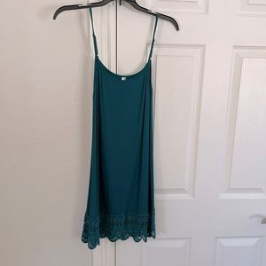 Teal slip style dress with crochet bottoms detail and adjustable straps size S